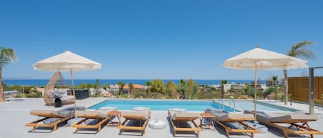 Outdoor pool, pool umbrellas, sun loungers