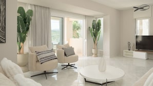 A modern living room with a sofa, armchair, coffee table, and potted plants.