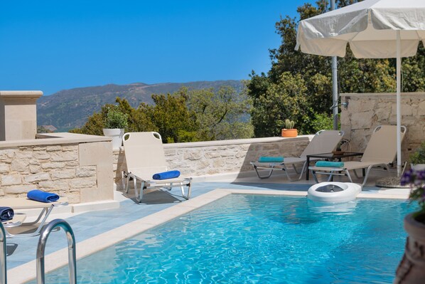 Outdoor pool, pool umbrellas, pool loungers