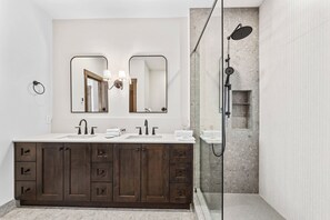 Shower, hair dryer, towels, toilet paper