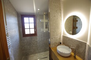 Shower, hair dryer, towels, toilet paper