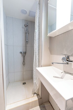 Shower, hair dryer, towels, soap