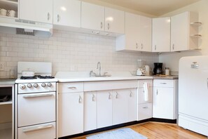 Fridge, oven, coffee/tea maker, cookware/dishes/utensils