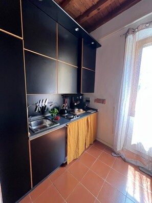 Fridge, microwave, stovetop, coffee/tea maker
