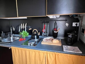 Fridge, microwave, stovetop, coffee/tea maker