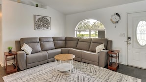 A modern living room with a sectional sofa, a round coffee table, and a patterned rug. - 5 Mi to Highlands Hammock: Home w/ Fenced-In Yard (Sebring)