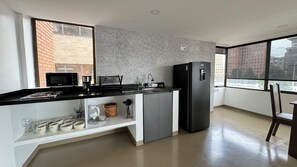 Suite, City View | Private kitchen - OPE SUITES CALLE 100 (Bogotá)