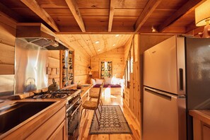 Fridge, oven, coffee/tea maker, cookware/dishes/utensils