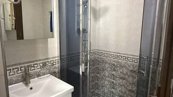 Shower, towels, toilet paper