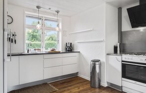 Fridge, stovetop, dishwasher, coffee/tea maker