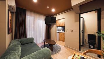 Deluxe Apartment, 2 Bedrooms | Living area | 42-inch LED TV with digital channels, Netflix, streaming services