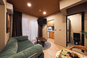 Deluxe Apartment, 2 Bedrooms | Living area | 42-inch LED TV with digital channels, Netflix, streaming services - Tare Suites Beşiktaş (İstanbul)