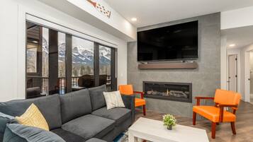 Smart TV, chimenea, biblioteca de música, videoteca