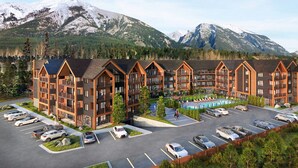 A multi-story lodge with a pool and mountain views. - Luxury 8-BR Family Home with Exceptional Amenities (Canmore)