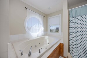 Shower, jetted tub, towels