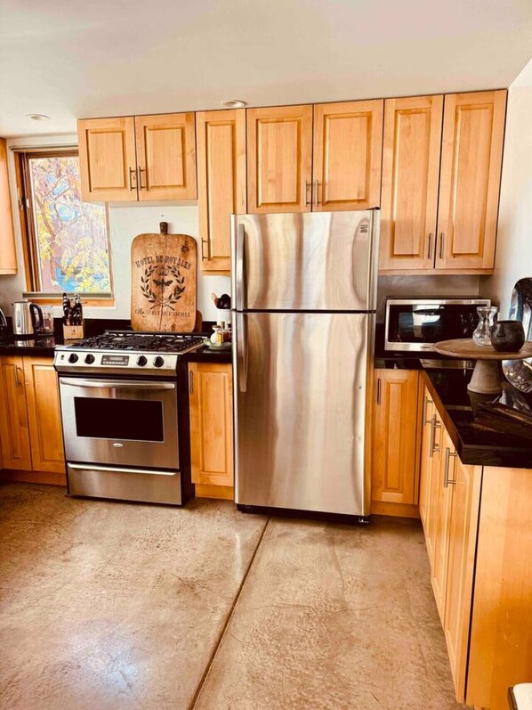 Fridge, coffee/tea maker, cookware/dishes/utensils