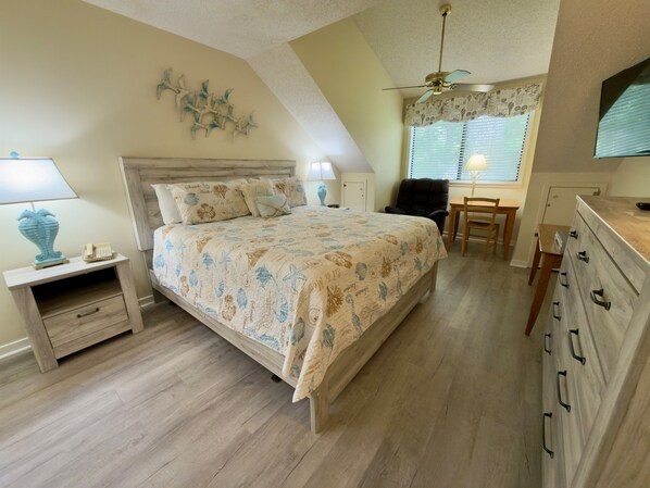 A bedroom with a bed, bedside tables, a desk, and a chair. - W Hyde Pk 8E in Kingston 2nd floor, Pool, Beach (Myrtle Beach)