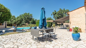A patio area with a pool, outdoor furniture, and a covered seating area. - Lovely home in Saint Cezaire (Saint Cezaire)
