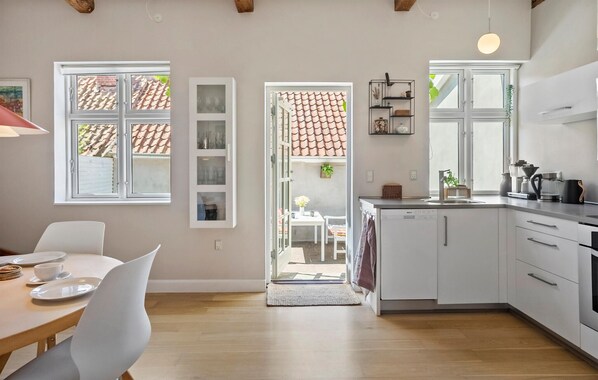 Fridge, stovetop, dishwasher, coffee/tea maker