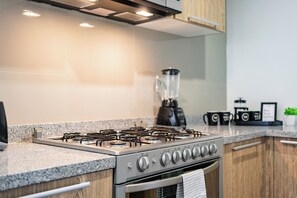 Microwave, coffee/tea maker, toaster, cookware/dishes/utensils