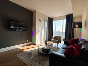 Apartamento superluxo, vista para a cidade | Área de estar