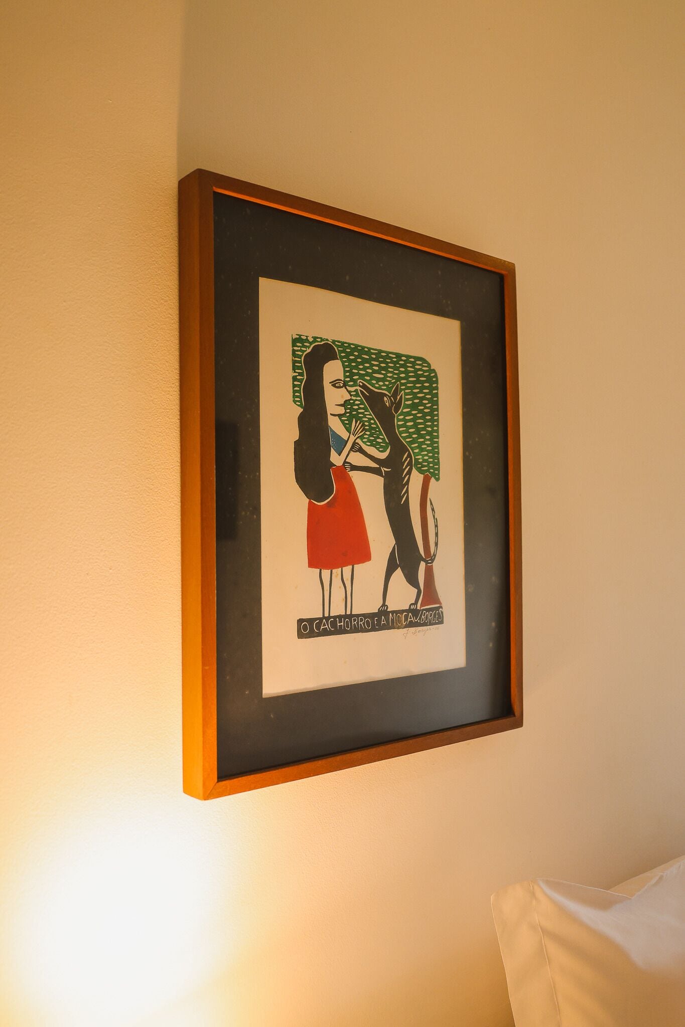 A framed artwork on a wall.