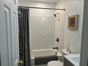 Shower, towels, soap, toilet paper