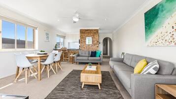 Apartment, 2 Bedrooms, Balcony, Partial Ocean View | Living area | 55-inch Smart TV with digital channels