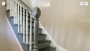 A staircase with a handrail and steps.