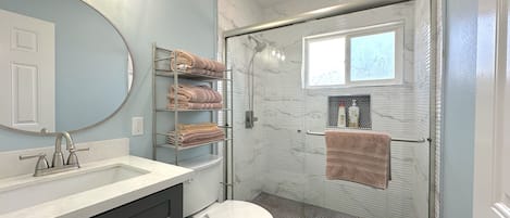 Shower, hair dryer, towels, soap