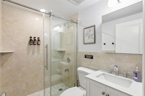 Shower, hair dryer, towels, soap