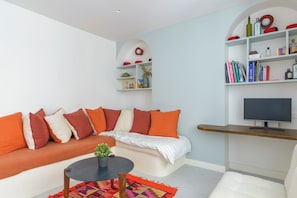 Apartamento conforto, vista para o pátio | Área de estar