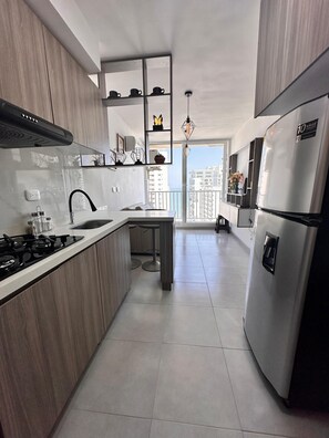 Fridge, stovetop, electric kettle, toaster