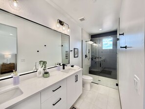 Shower, hair dryer, towels, shampoo