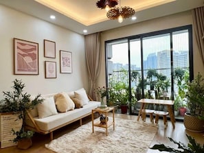 Comfort Apartment, 3 Bedrooms, 2 Bathrooms | Living area | 65-inch flat-screen TV with digital channels, Netflix, pay movies
