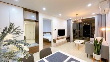 Comfort Apartment, 1 Bedroom, Private Bathroom | Living area | 65-inch flat-screen TV with digital channels, Netflix, pay movies