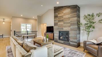 TV, fireplace, books