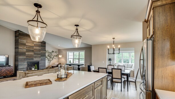 A spacious kitchen with a large island, stainless steel appliances, and pendant lighting. - Walk to Beaches + Restaurants: Elkhart Lake Escape (Elkhart Lake)