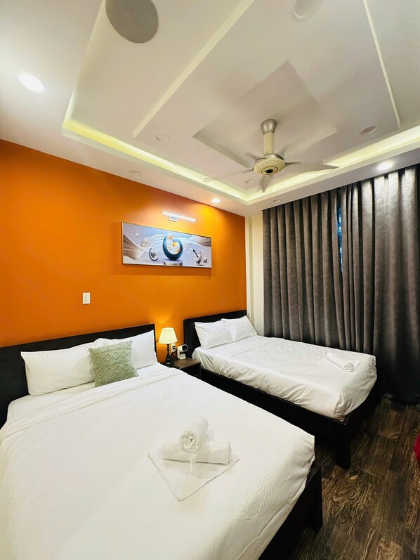 Family Triple Room | Desk, blackout drapes, iron/ironing board, free WiFi