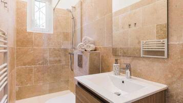 Shower, hair dryer, towels