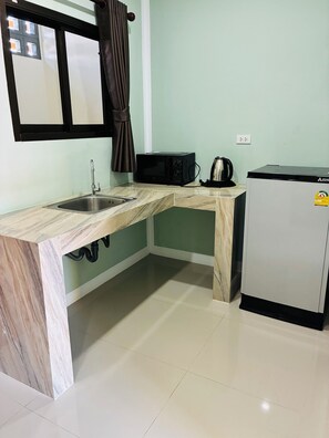Fridge, microwave, cookware/dishes/utensils