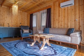 Deluxe-Villa, Terrasse, Poolblick | Wohnbereich