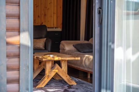 Deluxe Villa, Patio, Pool View | Living area