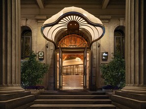 A grand entrance with a large, ornate archway leading to a well-lit interior. - Grand Madison Wuhan Hankou on the Bund (Wuhan)