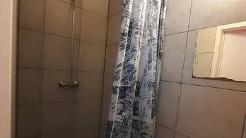 Twin Room | Bathroom | Shower, towels, soap, toilet paper