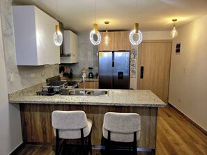 Fridge, oven, coffee/tea maker, high chair