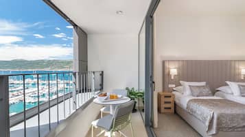 Deluxe Double or Twin Room, Balcony, Sea View | Minibar, in-room safe, desk, blackout drapes