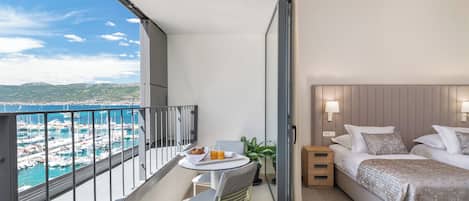 Deluxe Double or Twin Room, Balcony, Sea View | Minibar, in-room safe, desk, blackout curtains