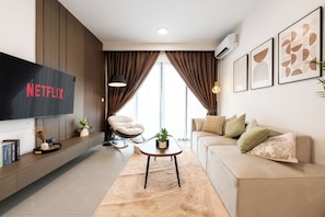 Comfort Apartment | Living area | 43-inch Smart TV with digital channels