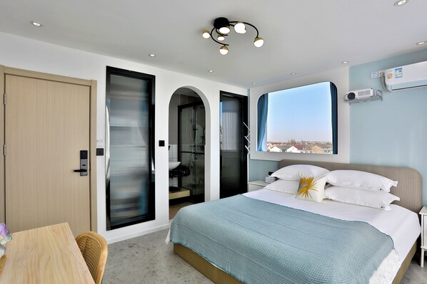 Junior Triple Room | Down comforters, laptop workspace, blackout drapes, iron/ironing board